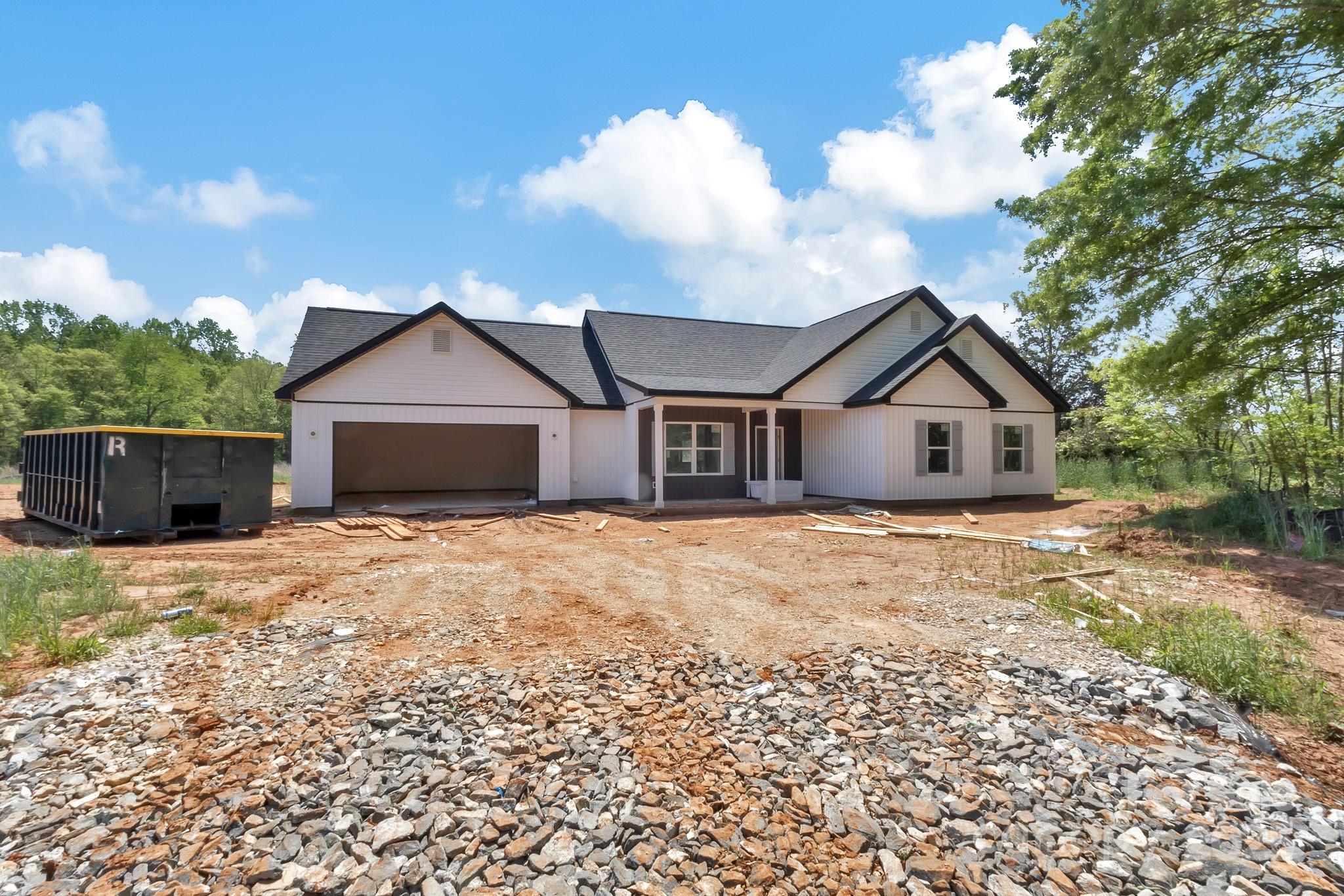 6259 Long Branch Road Salisbury, NC 28147 - Photo 2 of 48 a front view of a house with a yard and garage