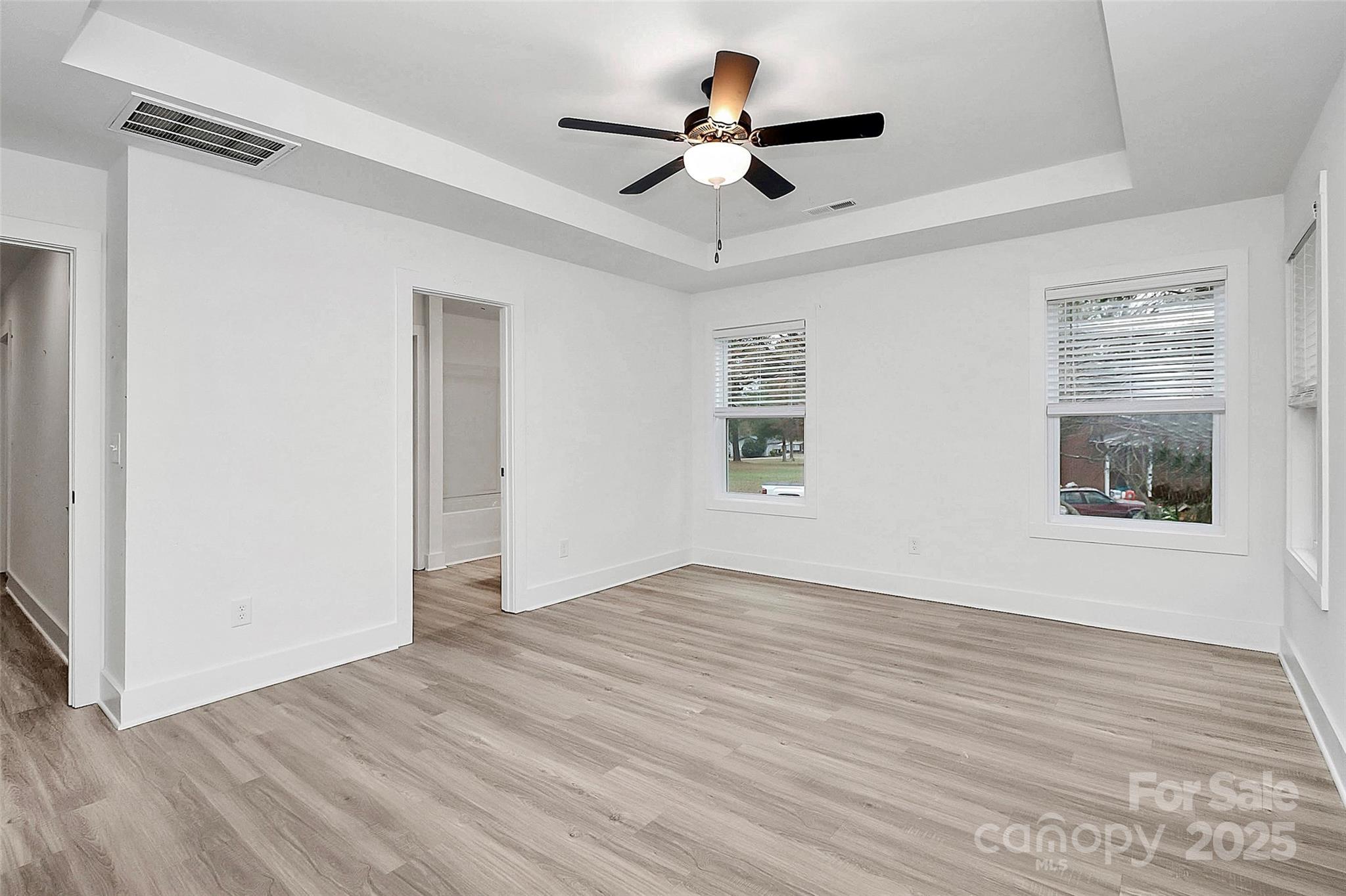 6259 Long Branch Road Salisbury, NC 28147 - Photo 21 of 48 a view of room with wooden floor and ceiling fan