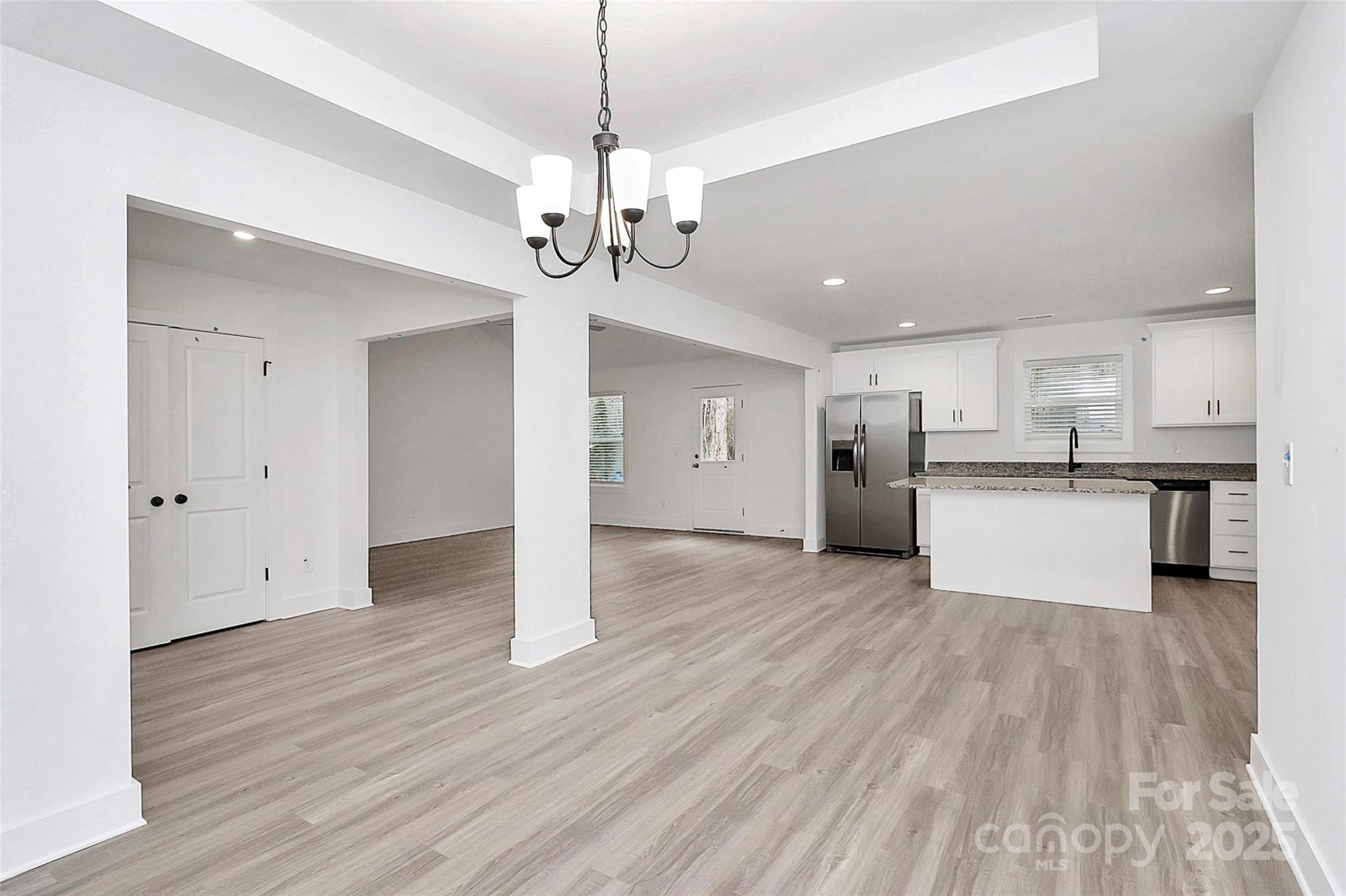 6259 Long Branch Road Salisbury, NC 28147 - Photo 6 of 48 a view of a kitchen with stainless steel appliances granite countertop wooden floors and a view of kitchen