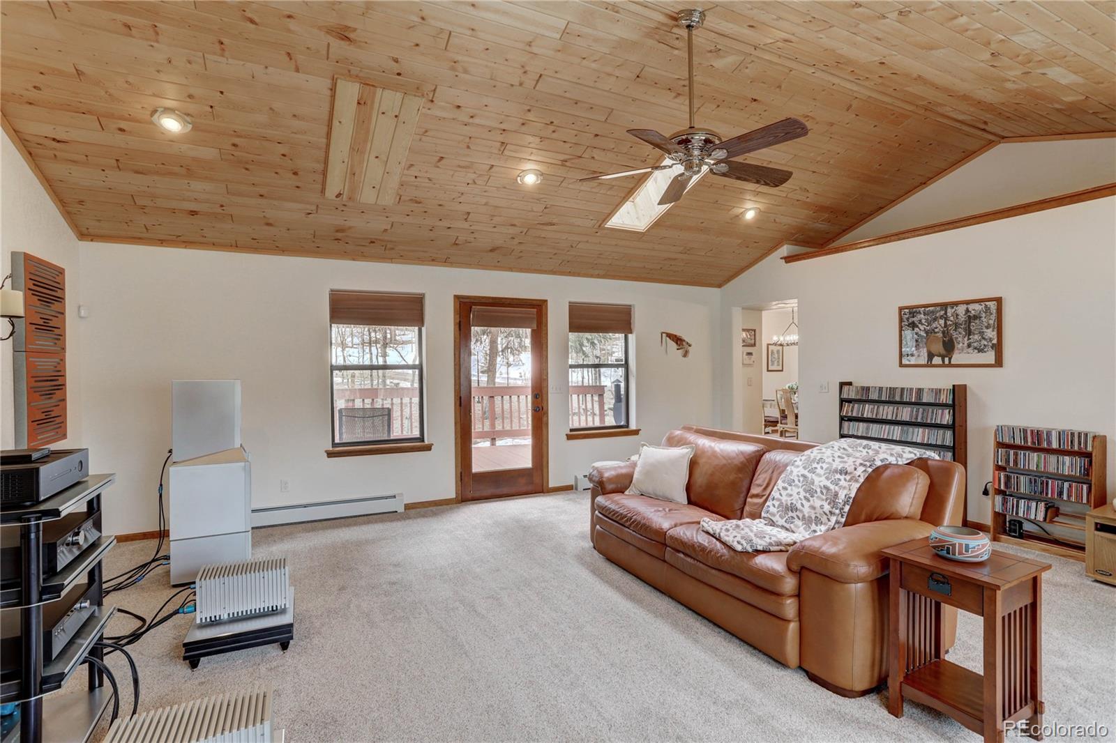105 Desperado Road Bailey, CO 80421 - Photo 21 of 40 a living room with furniture and a large window