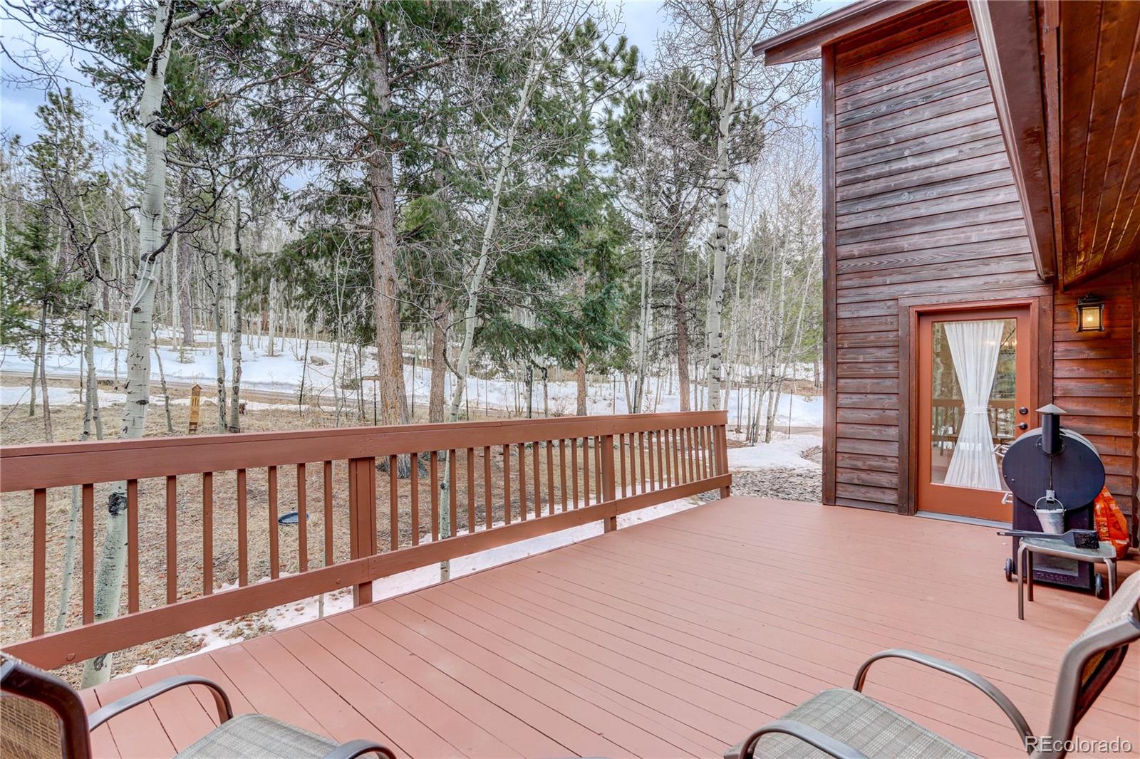 105 Desperado Road Bailey, CO 80421 - Photo 22 of 40 a view of a chairs and tables in the balcony