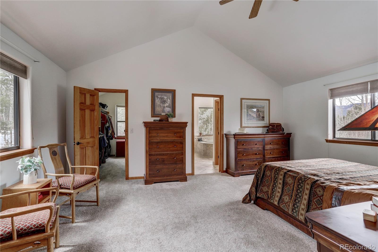 105 Desperado Road Bailey, CO 80421 - Photo 26 of 40 a bedroom with a bed and a couch