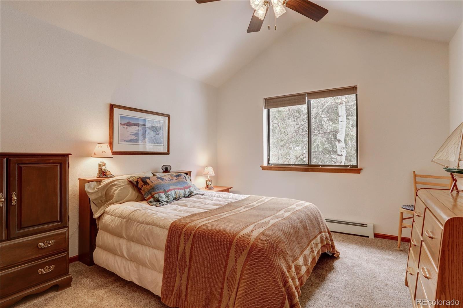 105 Desperado Road Bailey, CO 80421 - Photo 31 of 40 a bedroom with bed and a window