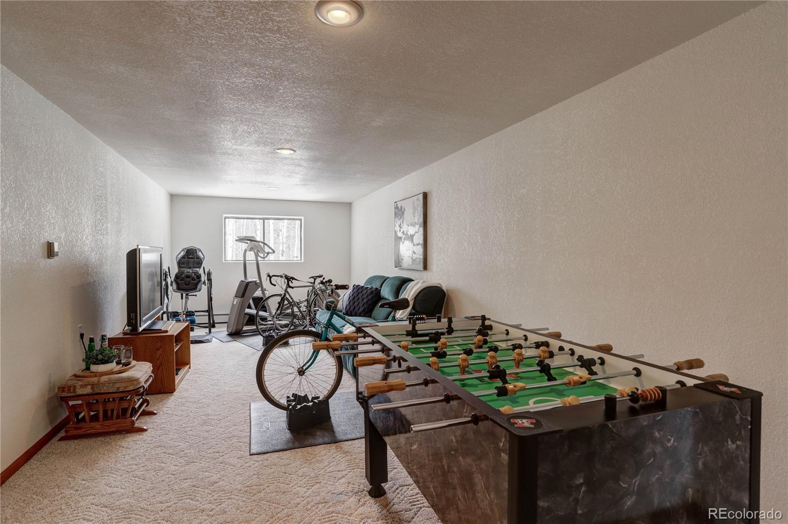 105 Desperado Road Bailey, CO 80421 - Photo 36 of 40 a very nice looking room with many windows