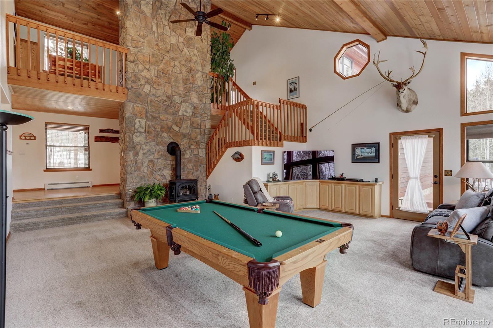 105 Desperado Road Bailey, CO 80421 - Photo 9 of 40 a room with pool table and windows