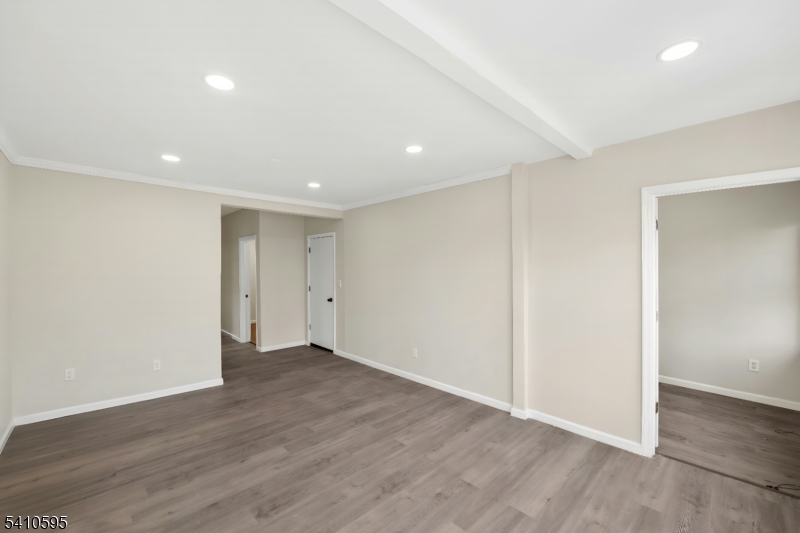 335 Boulevard Passaic, NJ 07055 - Photo 11 of 35 a view of an empty room with wooden floor