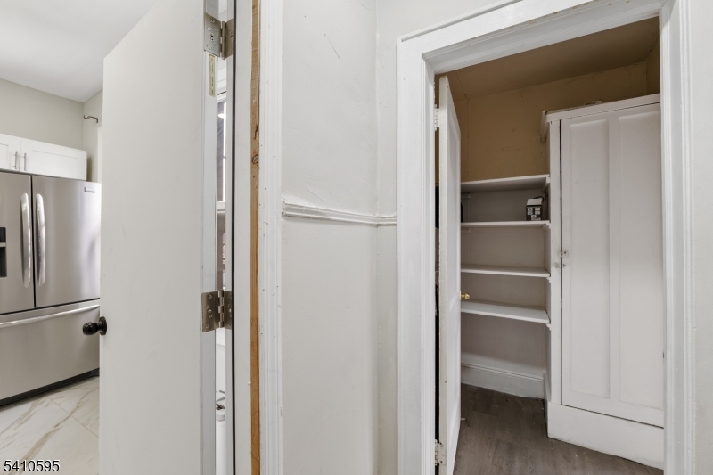 335 Boulevard Passaic, NJ 07055 - Photo 12 of 35 a view of walk in closet with empty racks