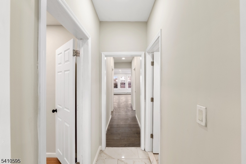 335 Boulevard Passaic, NJ 07055 - Photo 14 of 35 a view of a hallway with wooden floor and closet