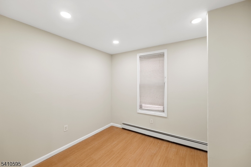 335 Boulevard Passaic, NJ 07055 - Photo 18 of 35 an empty room with a window