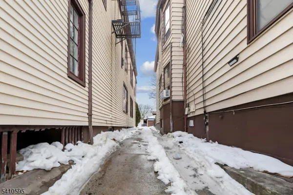 a view of a house with a snow in the yard