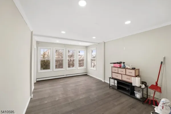 a room with furniture and wooden floor