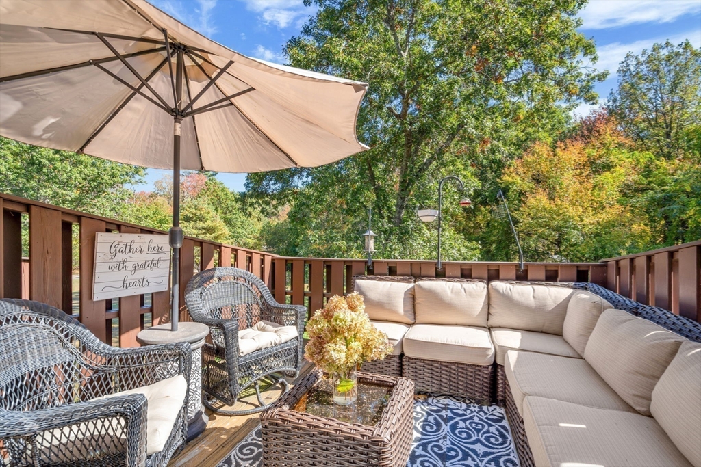 14 Hawthorne Village, Unit D Franklin, MA 02038 - Photo 16 of 42 a balcony with furniture and umbrella