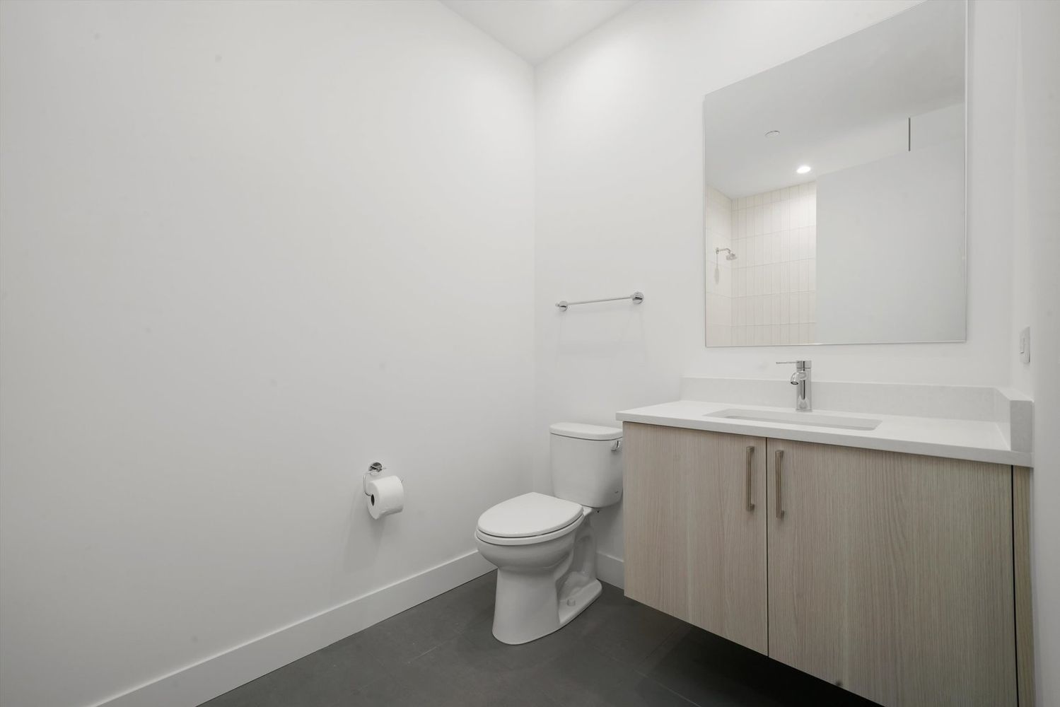 323 South Racine Avenue, Unit 3C Chicago, IL 60607 - Photo 16 of 18 a bathroom with a toilet a sink and mirror