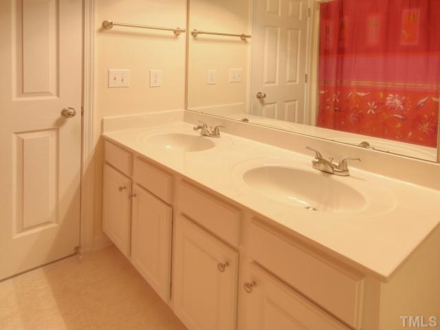 7409 Lagrange Drive Raleigh, NC 27613 - Photo 17 of 25 a bathroom with a sink and a mirror