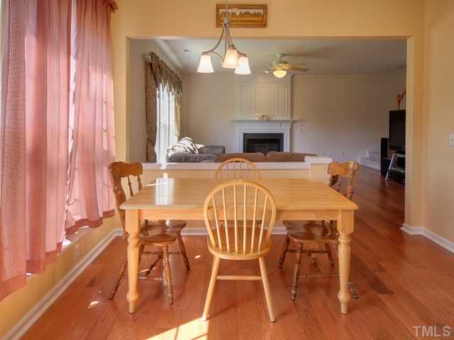 7409 Lagrange Drive Raleigh, NC 27613 - Photo 10 of 25 a view of a dining room with furniture and wooden floor