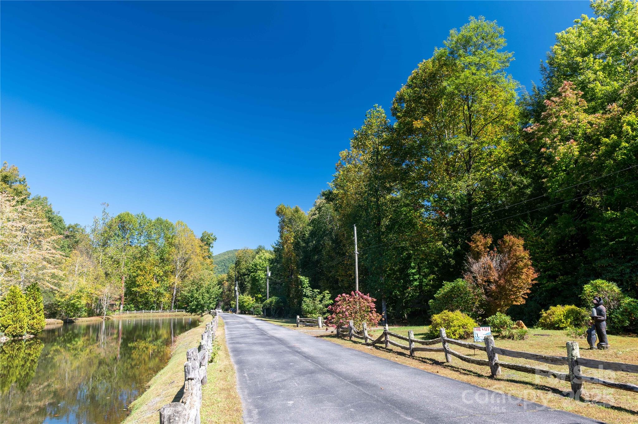 188 Sweetwater Ridge Green Mountain, NC 28740 - Photo 1 of 30 a view of a bench in a backyard