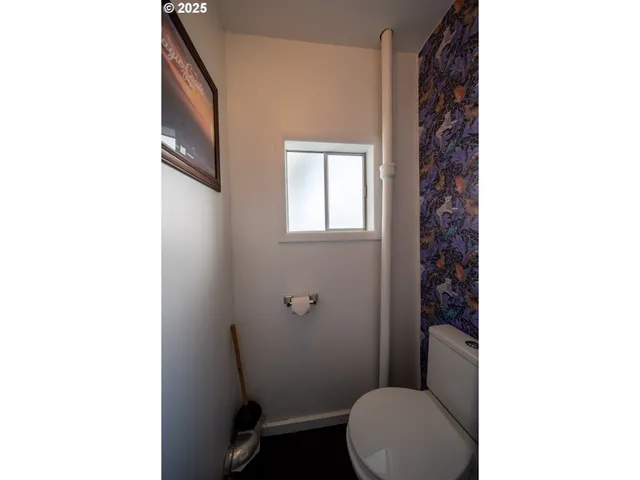 a bathroom with a toilet and a sink