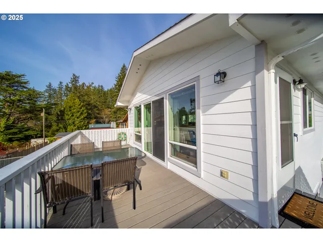 a balcony view with a seating space