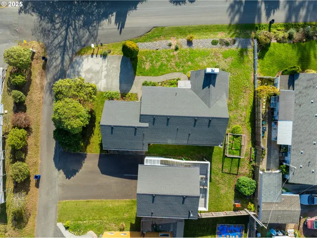 an aerial view of a house with a yard swimming pool outdoor seating and yard
