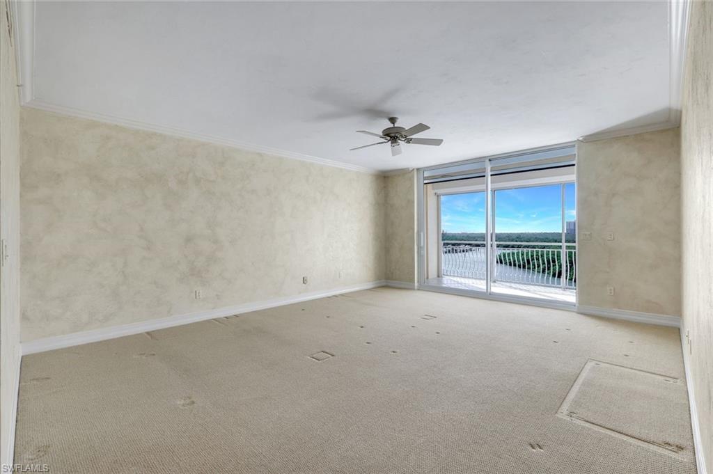 425 Dockside Drive, Unit 604 Naples, FL 34110 - Photo 15 of 34 an empty room with a empty space and windows