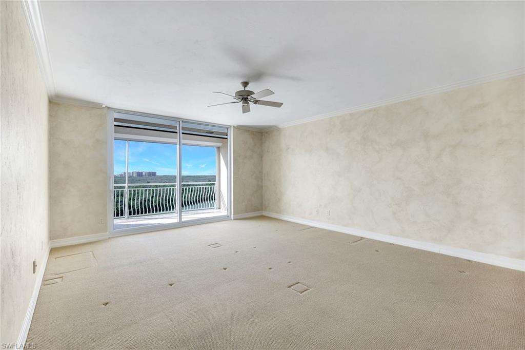 425 Dockside Drive, Unit 604 Naples, FL 34110 - Photo 19 of 34 an empty room with a empty space and windows