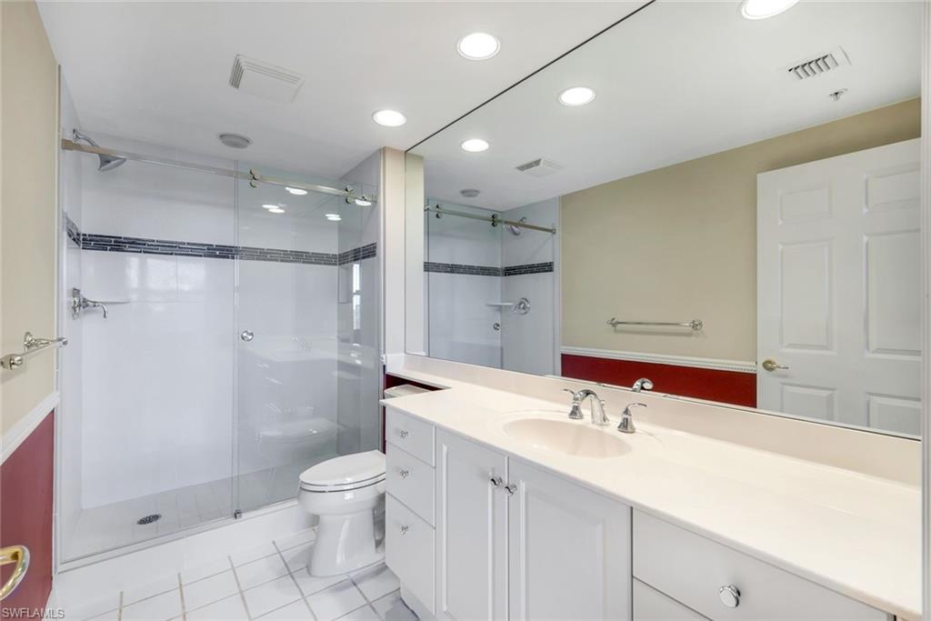 425 Dockside Drive, Unit 604 Naples, FL 34110 - Photo 23 of 34 a bathroom with a sink a toilet and shower