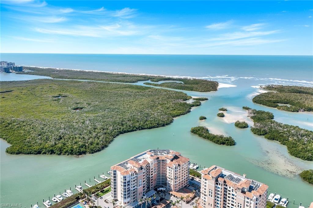 425 Dockside Drive, Unit 604 Naples, FL 34110 - Photo 27 of 34 a view of a lake with a mountain