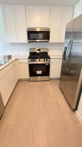 a bathroom with a sink a mirror and a window