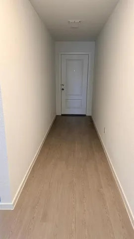 a view of empty room with windows