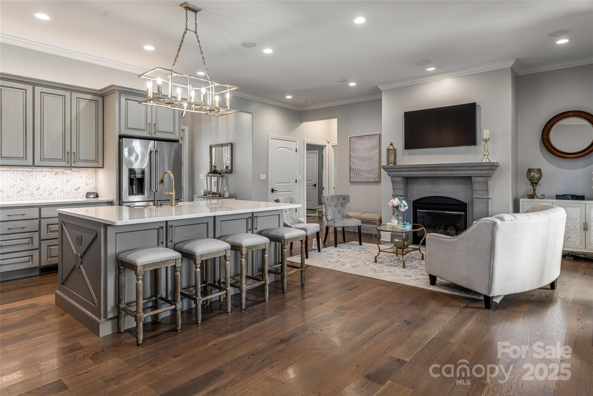 64 Waterhill Way Fletcher, NC 28732 - Photo 12 of 48 a living room with furniture a fireplace and a flat screen tv
