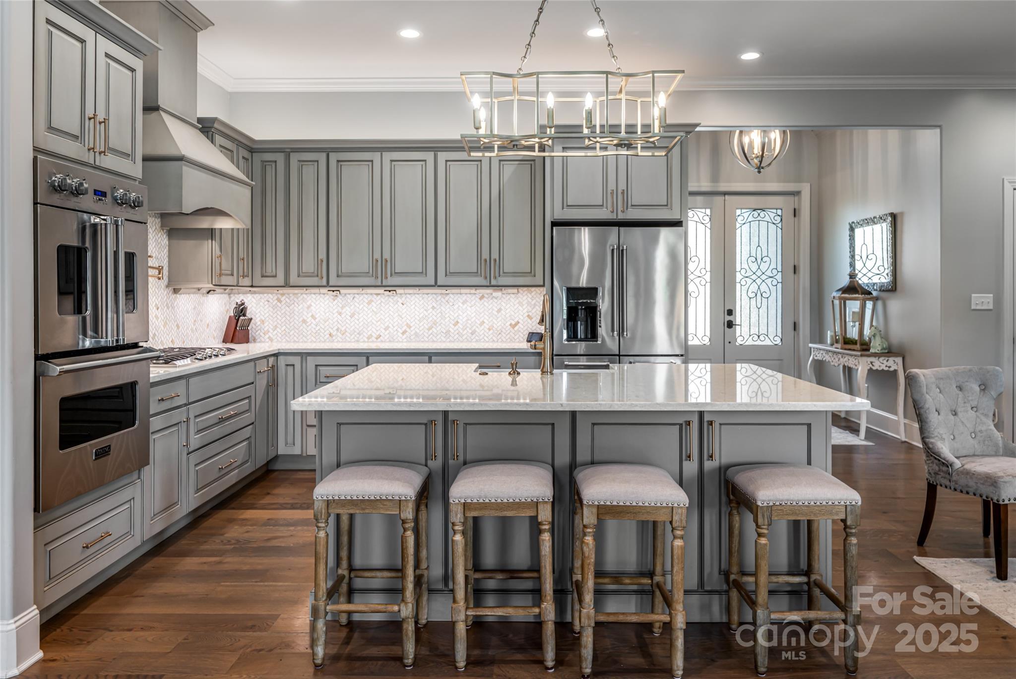 64 Waterhill Way Fletcher, NC 28732 - Photo 14 of 48 a kitchen with stainless steel appliances a dining table chairs and chandelier