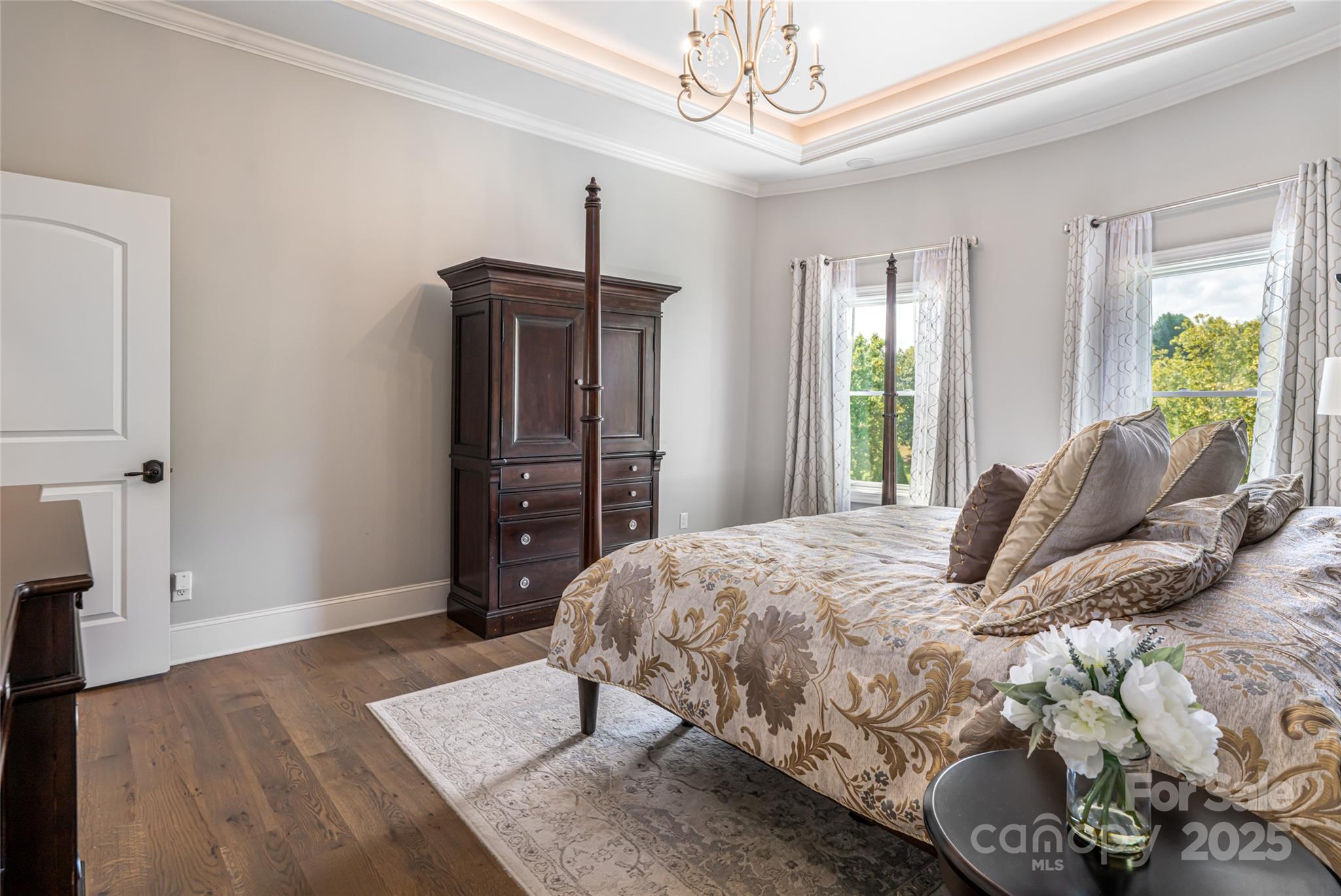 64 Waterhill Way Fletcher, NC 28732 - Photo 18 of 48 a bedroom with a bed and a chandelier