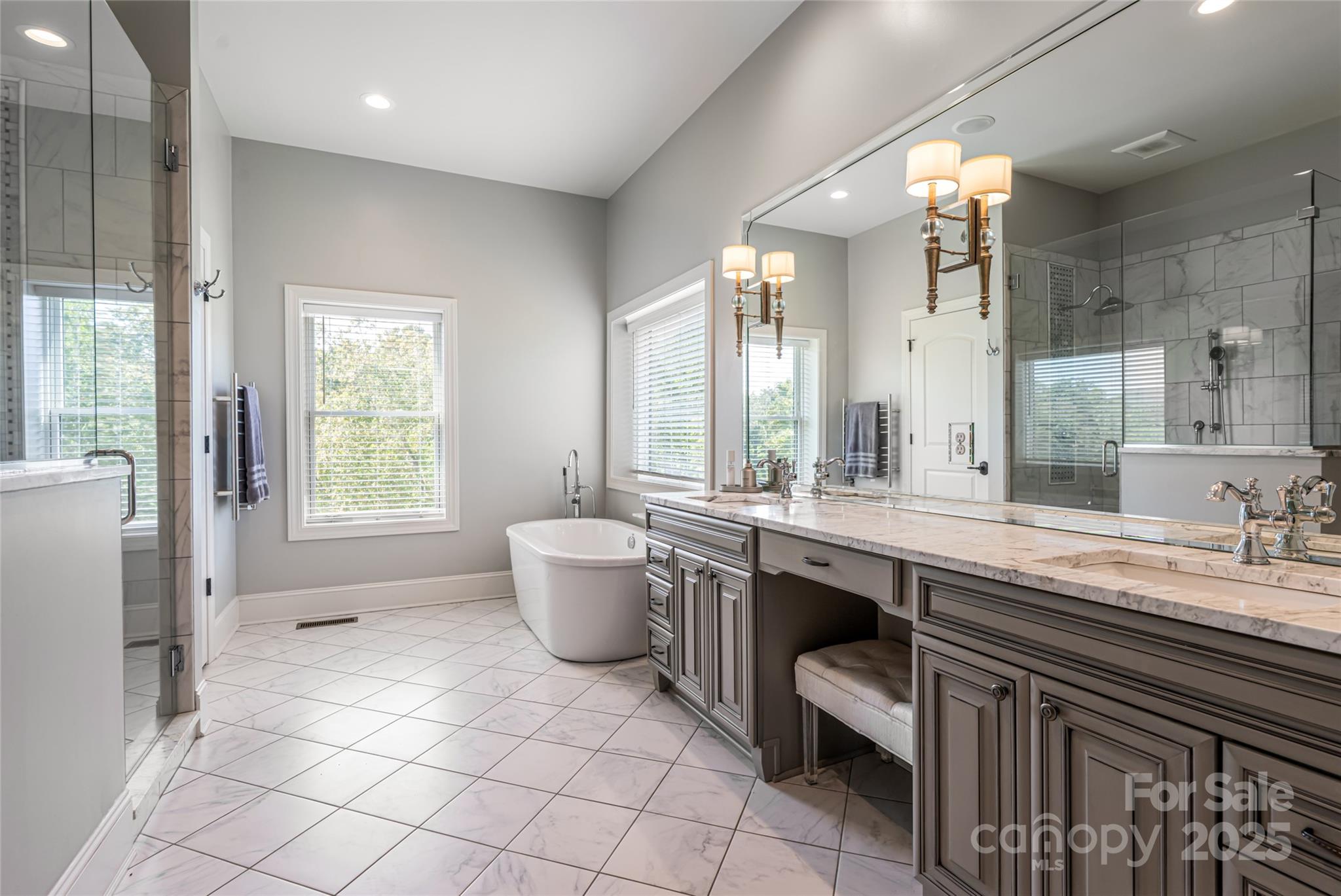 64 Waterhill Way Fletcher, NC 28732 - Photo 19 of 48 a spacious bathroom with a double vanity sink a large mirror and a bathtub