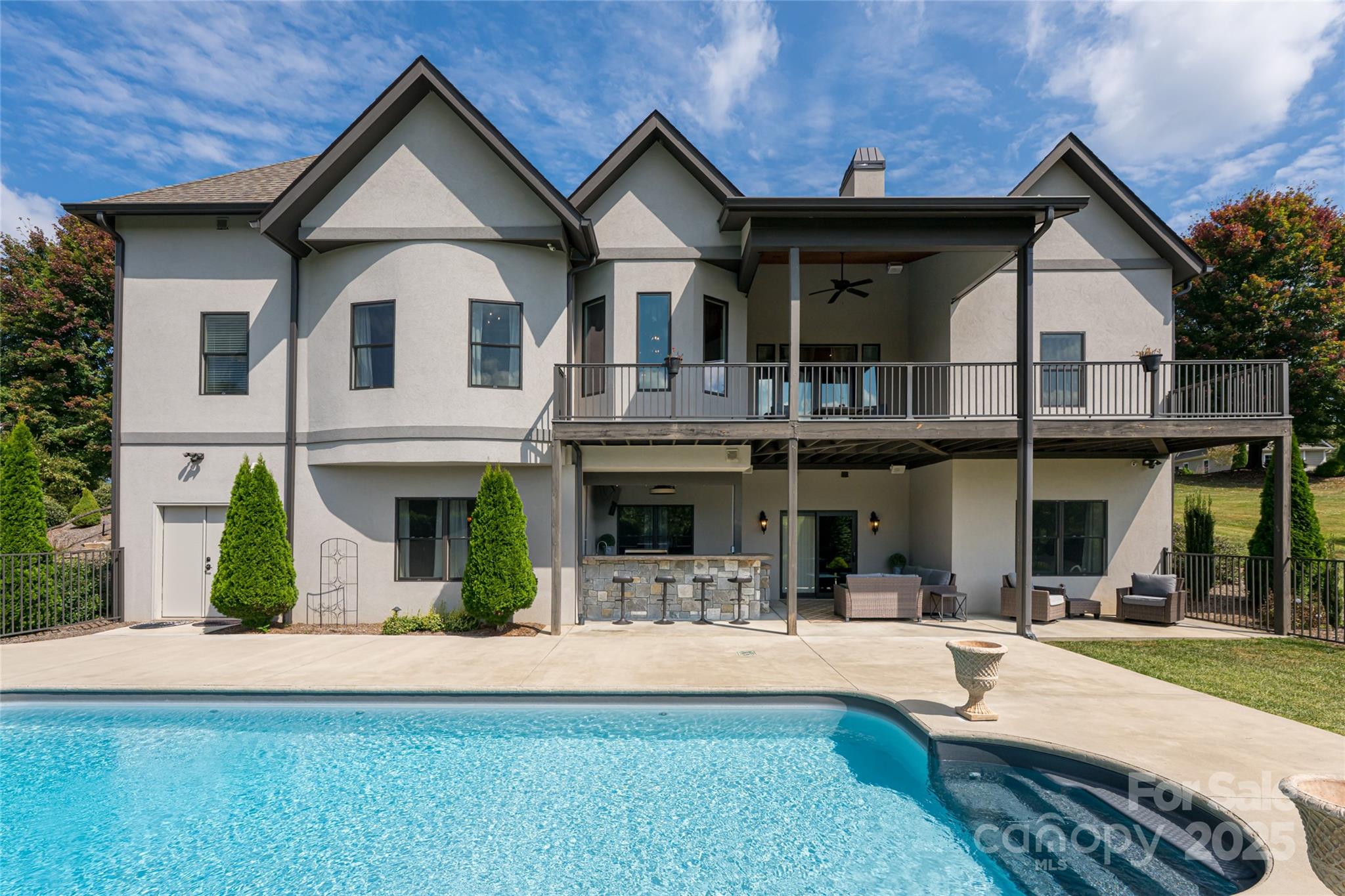 64 Waterhill Way Fletcher, NC 28732 - Photo 3 of 48 a view of a white house with large windows and a small yard