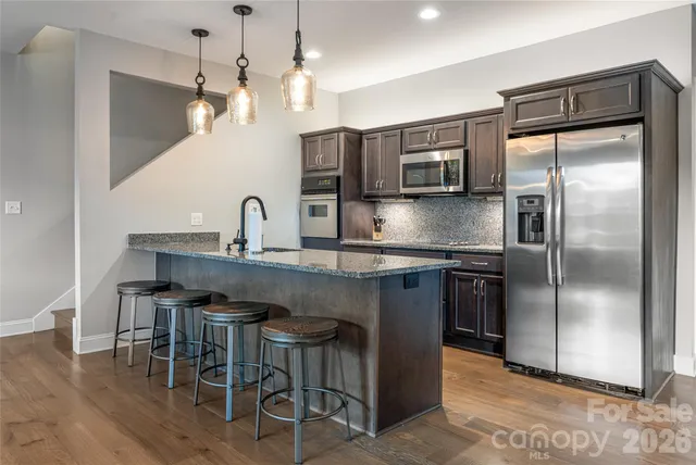 a balcony with table and chairs