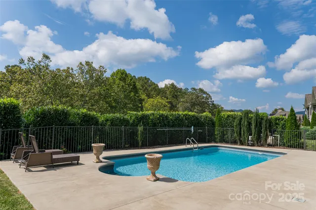 a view of a fountain in a back yard