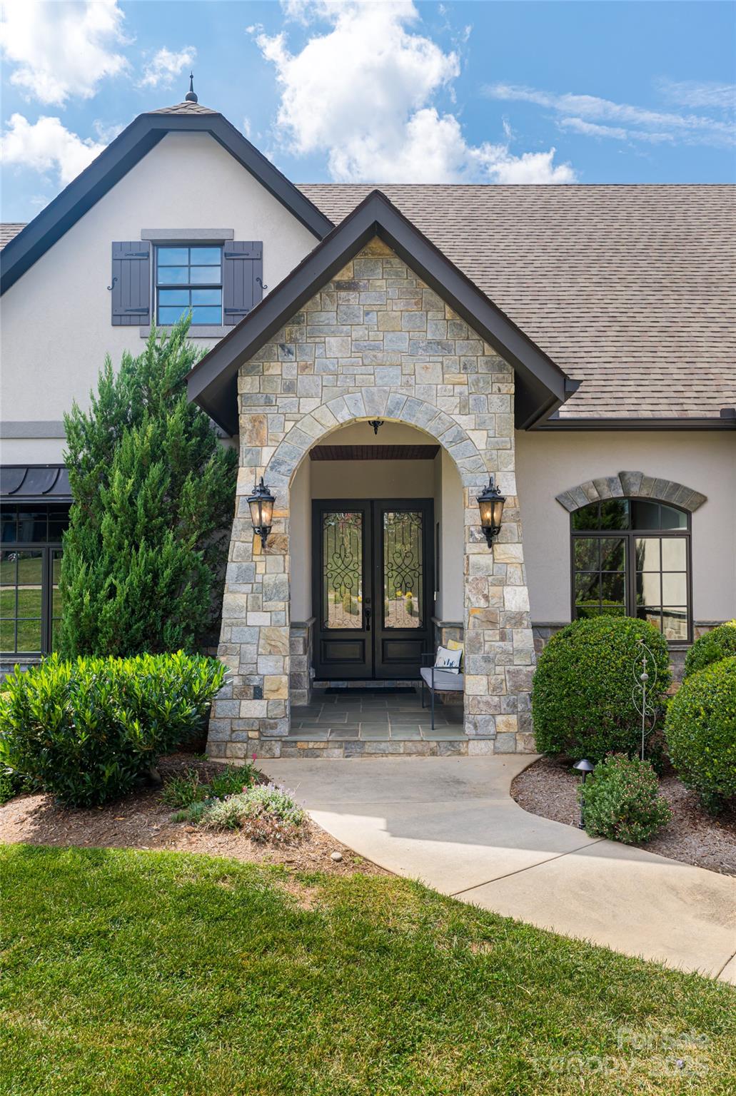 64 Waterhill Way Fletcher, NC 28732 - Photo 7 of 48 a view of a house with a small yard plants and a large tree