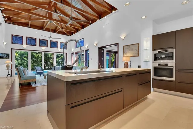 a kitchen with stainless steel appliances granite countertop a stove and a refrigerator