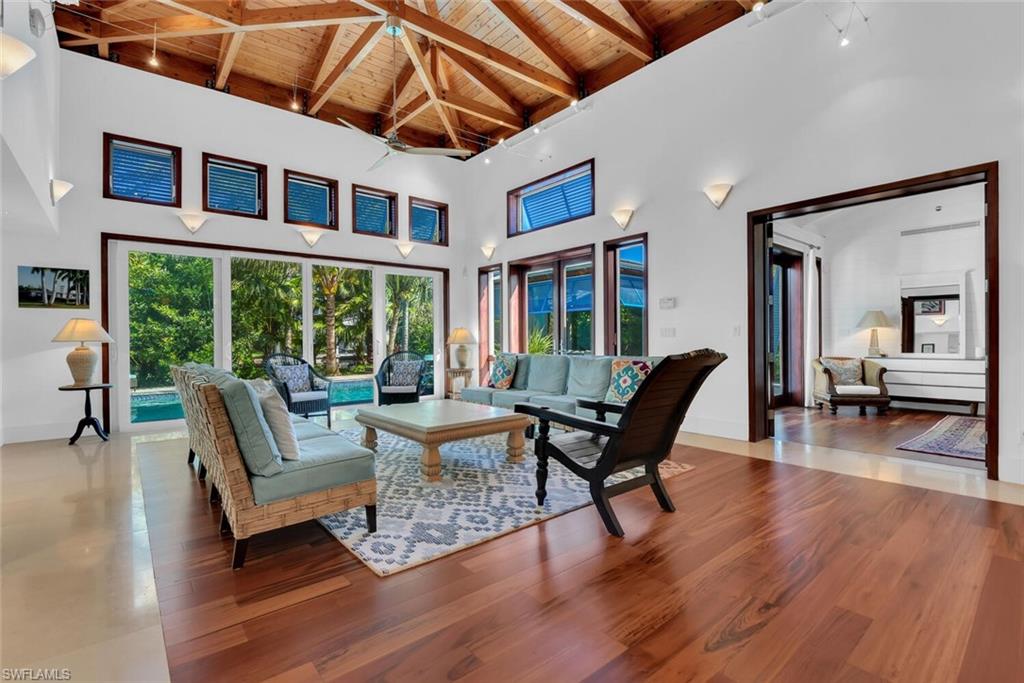 795 18th Avenue South Naples, FL 34102 - Photo 14 of 48 a outdoor living space with furniture and wooden floor