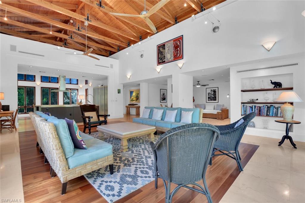 795 18th Avenue South Naples, FL 34102 - Photo 15 of 48 a living room with furniture and wooden floor
