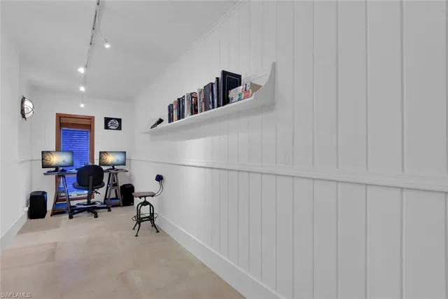 a spacious bedroom with a bed a couch and dresser