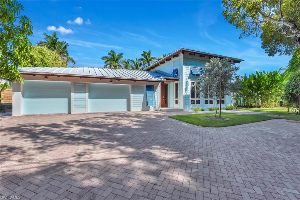 795 18th Avenue South Naples, FL 34102 - Photo 2 of 48 a view of a house with a yard