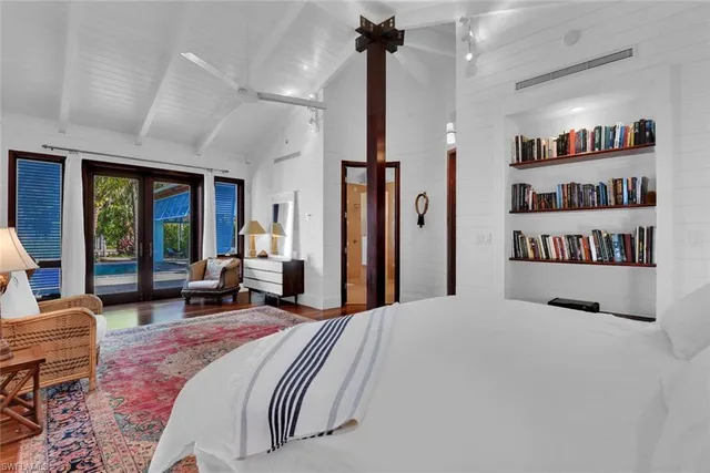 a bedroom with bed and window