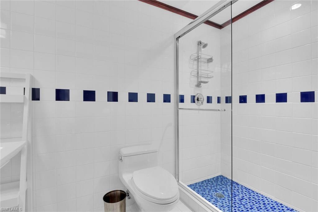795 18th Avenue South Naples, FL 34102 - Photo 29 of 48 a bathroom with a toilet and a shower