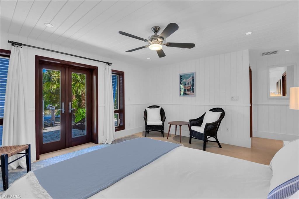 795 18th Avenue South Naples, FL 34102 - Photo 32 of 48 a bedroom with a bed and a window