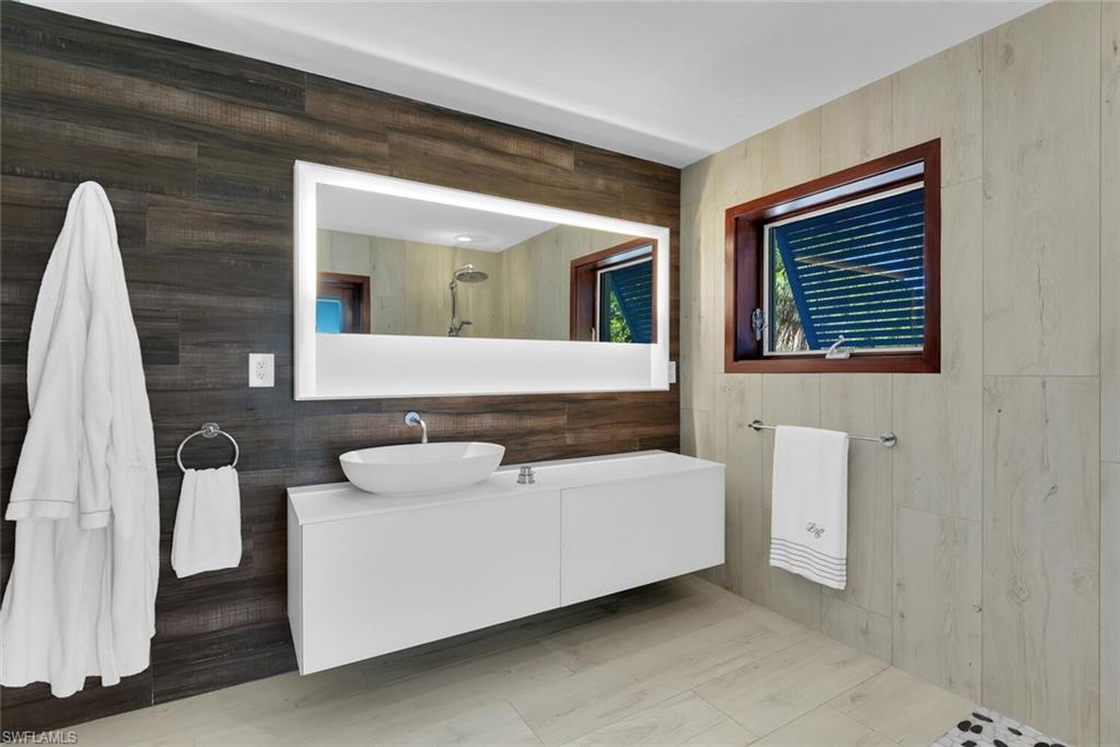 795 18th Avenue South Naples, FL 34102 - Photo 33 of 48 a living room with furniture and a window