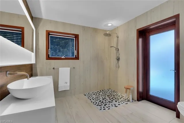 a view of backyard with swimming pool and outdoor seating