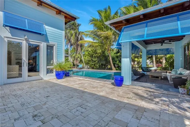 a view of swimming pool with a patio