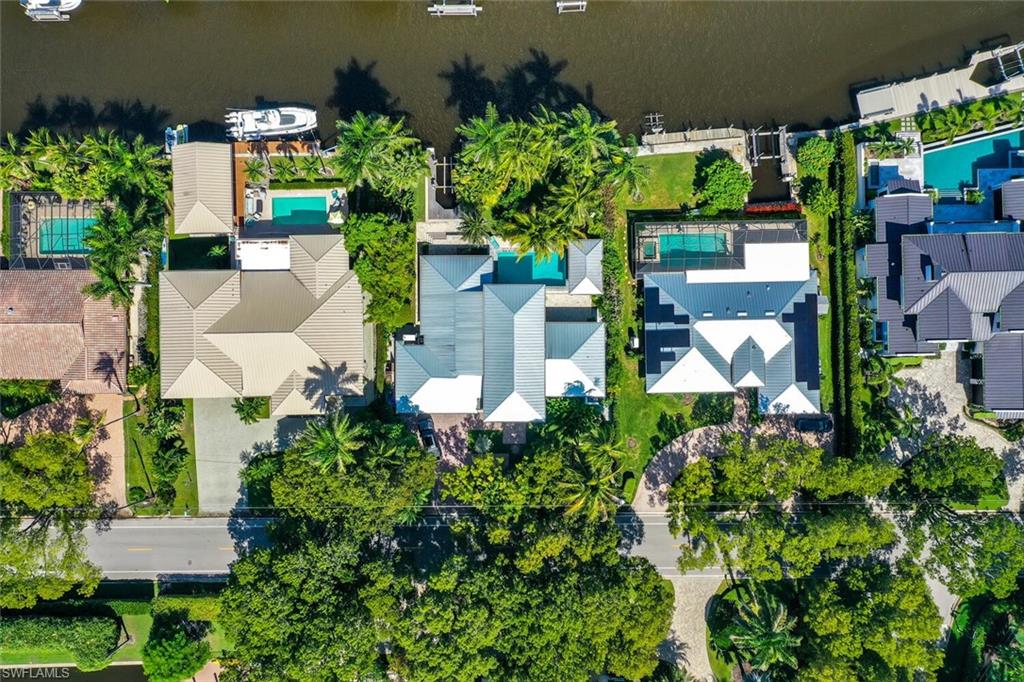 795 18th Avenue South Naples, FL 34102 - Photo 44 of 48 an aerial view of a house with a yard and lake view
