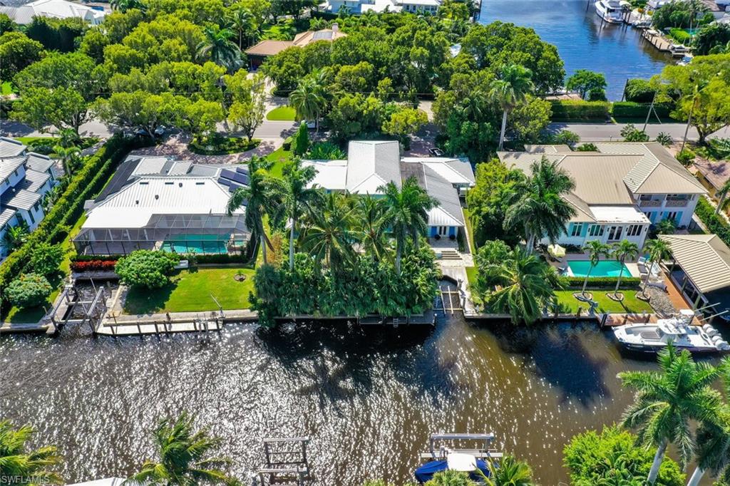 795 18th Avenue South Naples, FL 34102 - Photo 48 of 48 a view of a lake with a house in a background